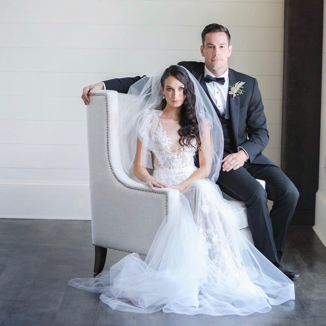 Editorial bridal couple portrait on elegant chair