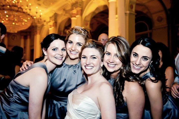 Bride with bridesmaids showing coordinated bridal party beauty