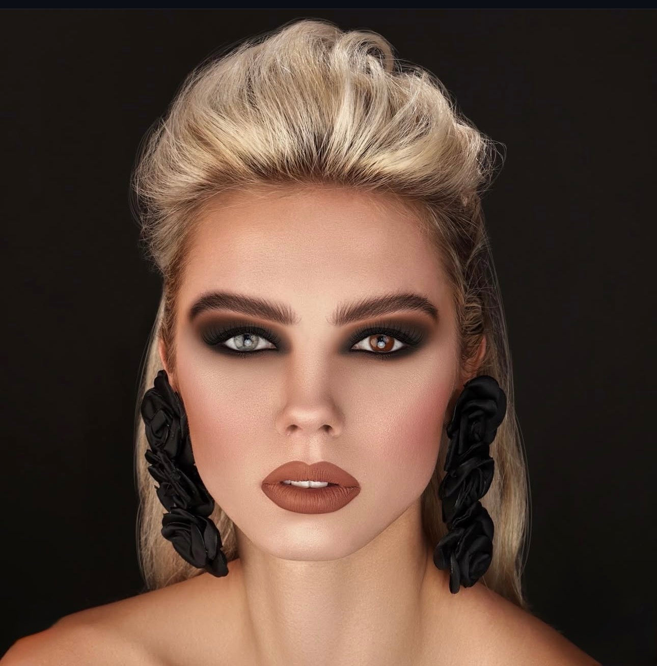 Edgy high-fashion makeup with textured pompadour hairstyle