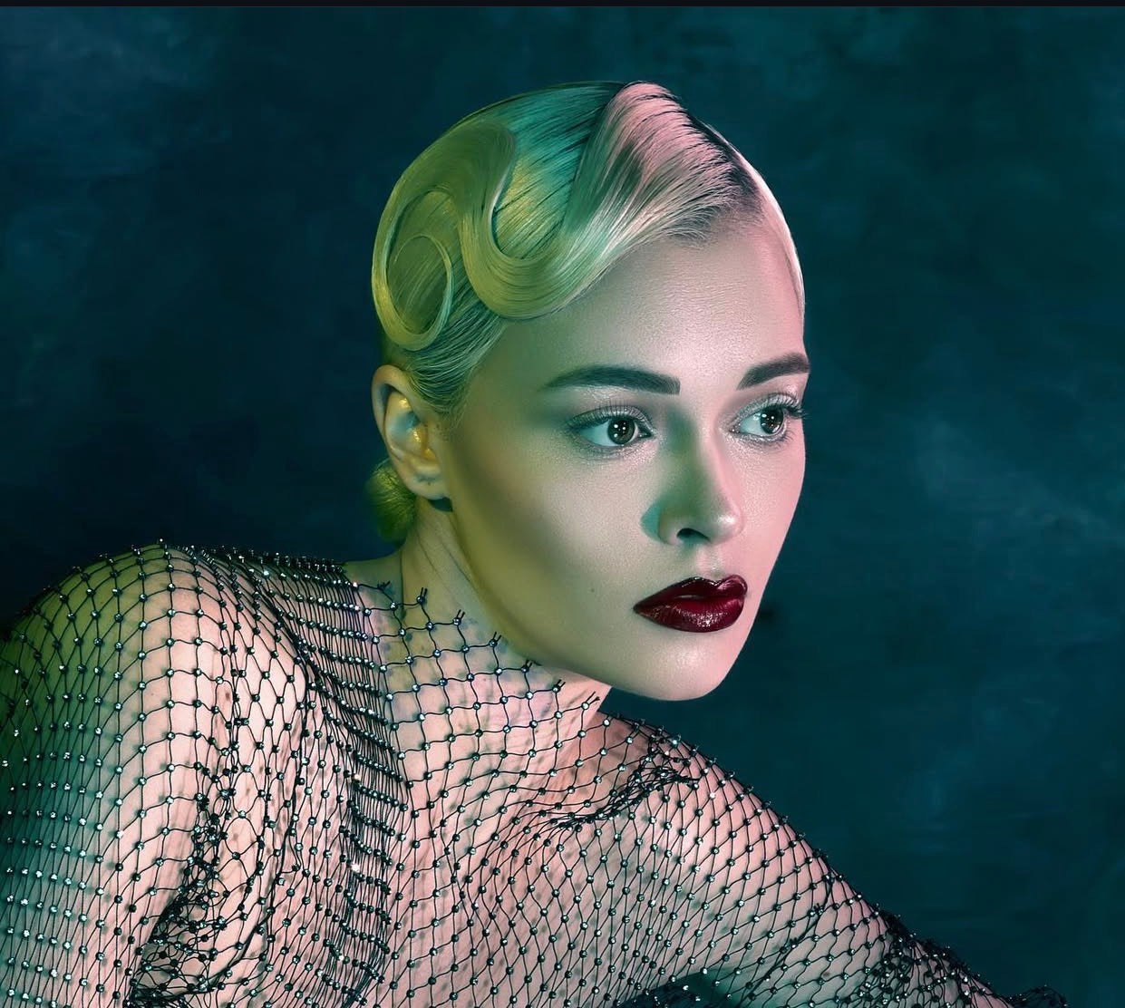 Avant-garde vintage finger waves with berry lip