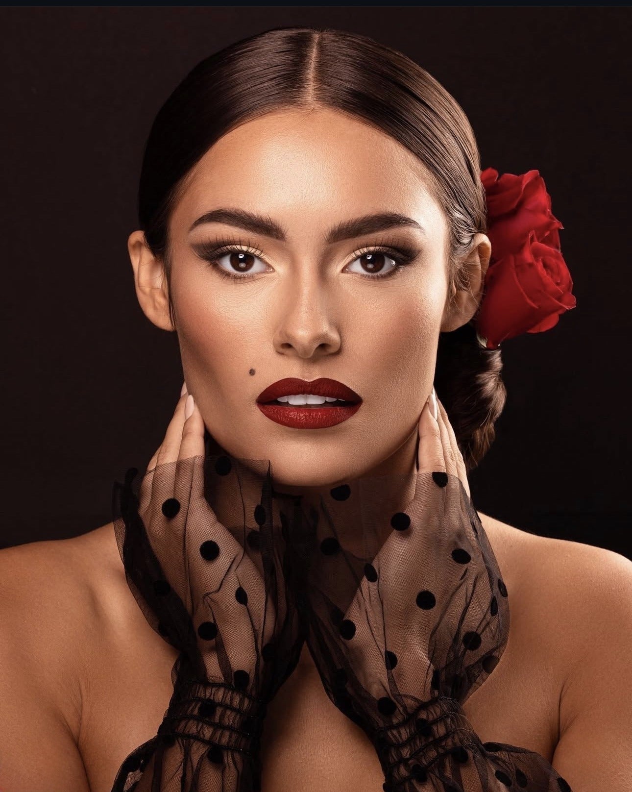 Flamenco-inspired editorial with red rose and bold lip