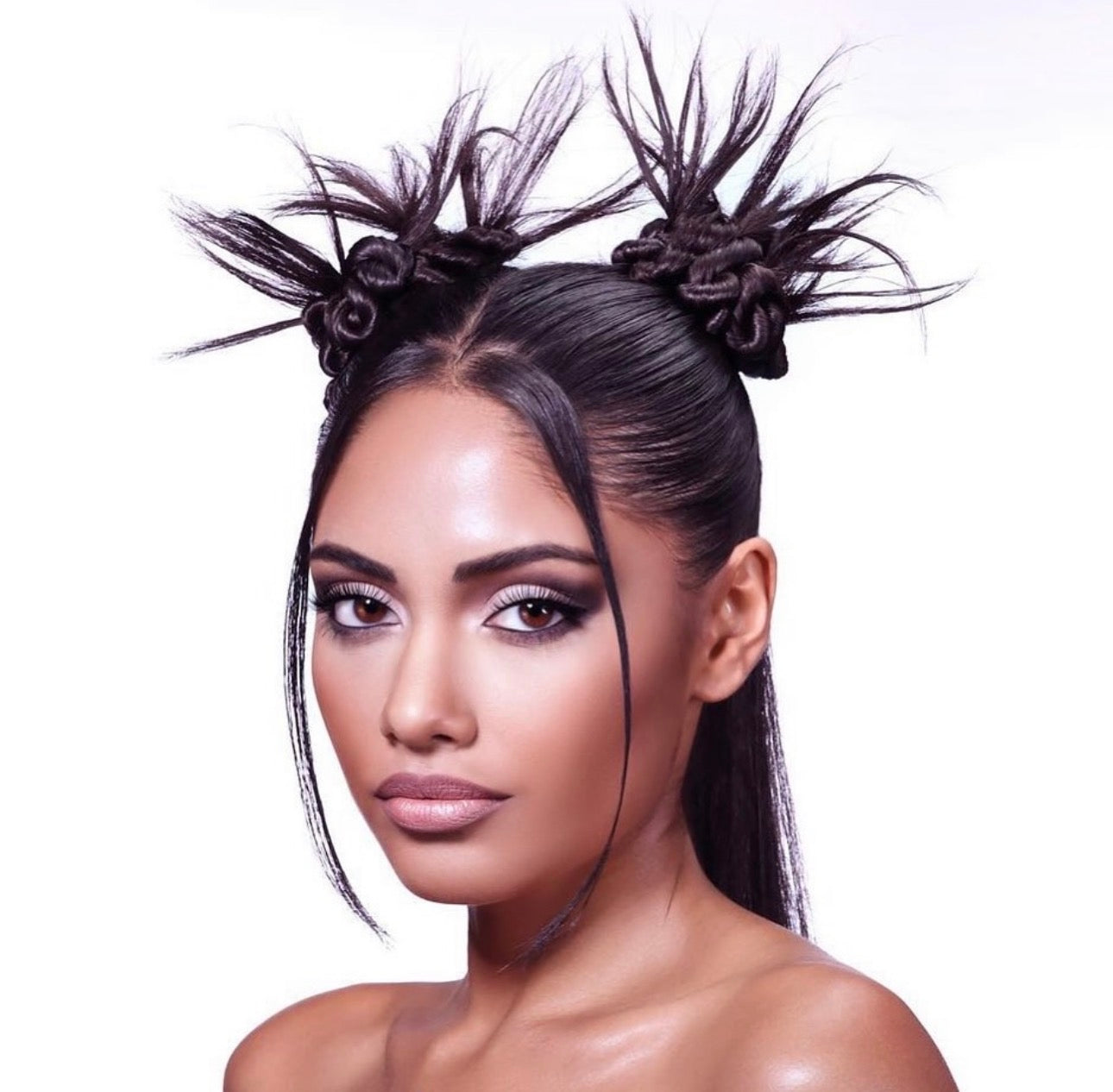 Fashion-forward sculptural hair with soft glam makeup
