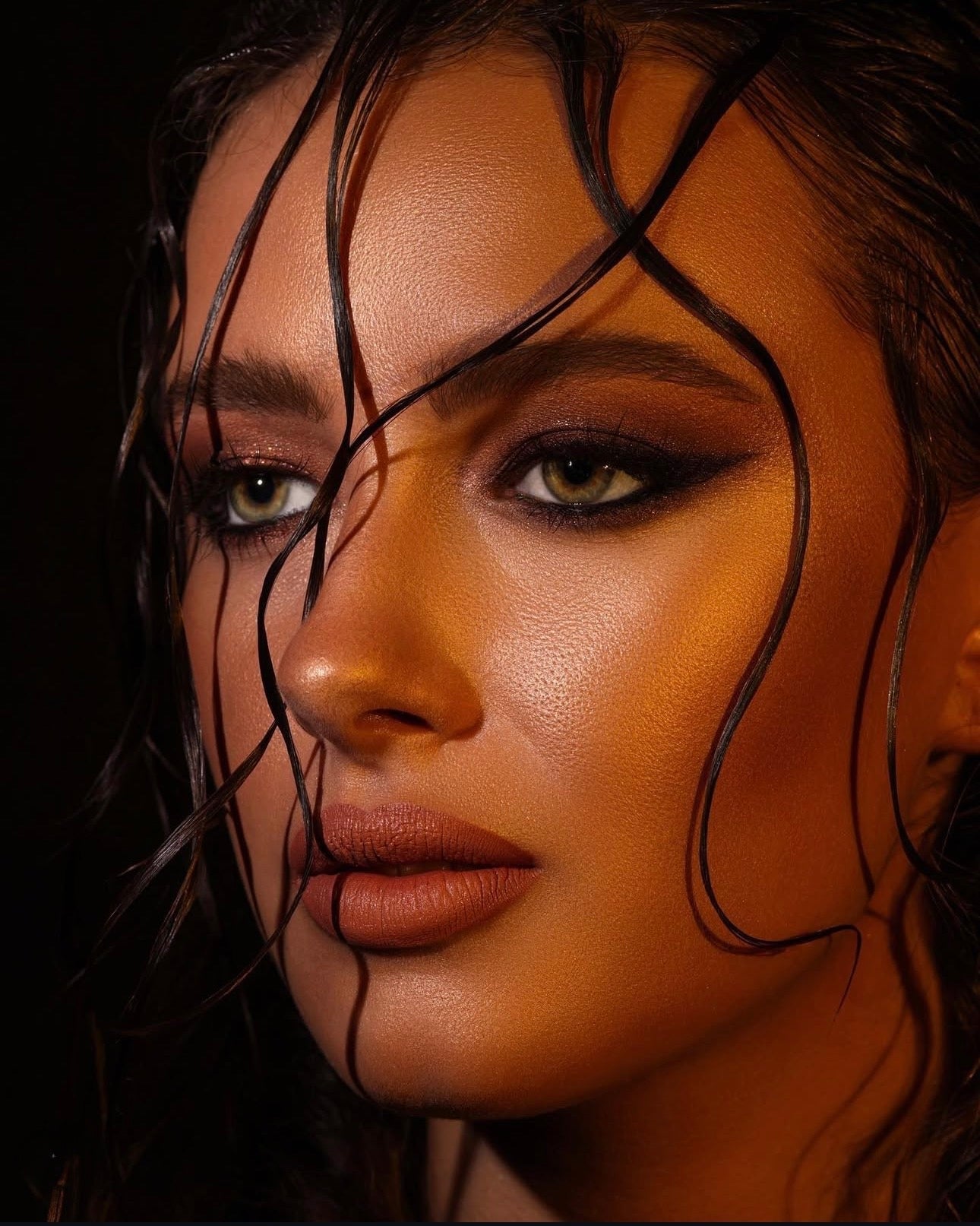 Dramatic smoky bronze editorial makeup by Sarai